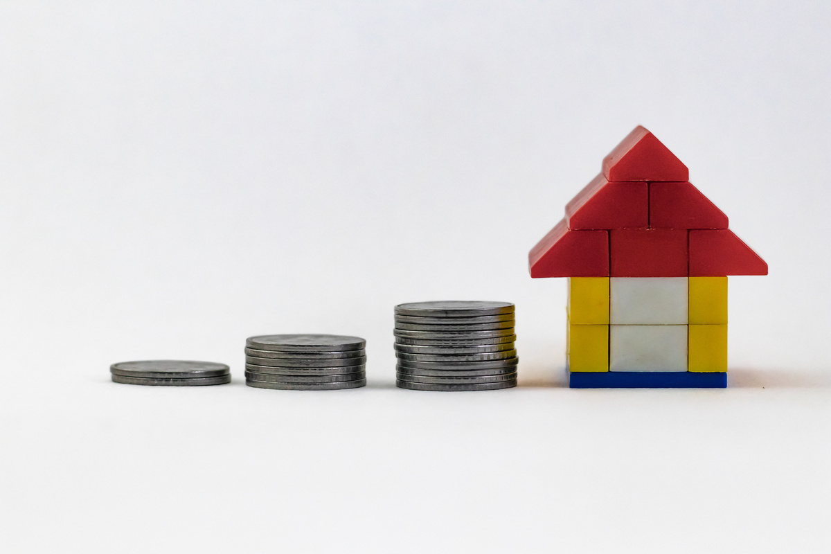 Three Steps of Piled up Coins and Lego House 